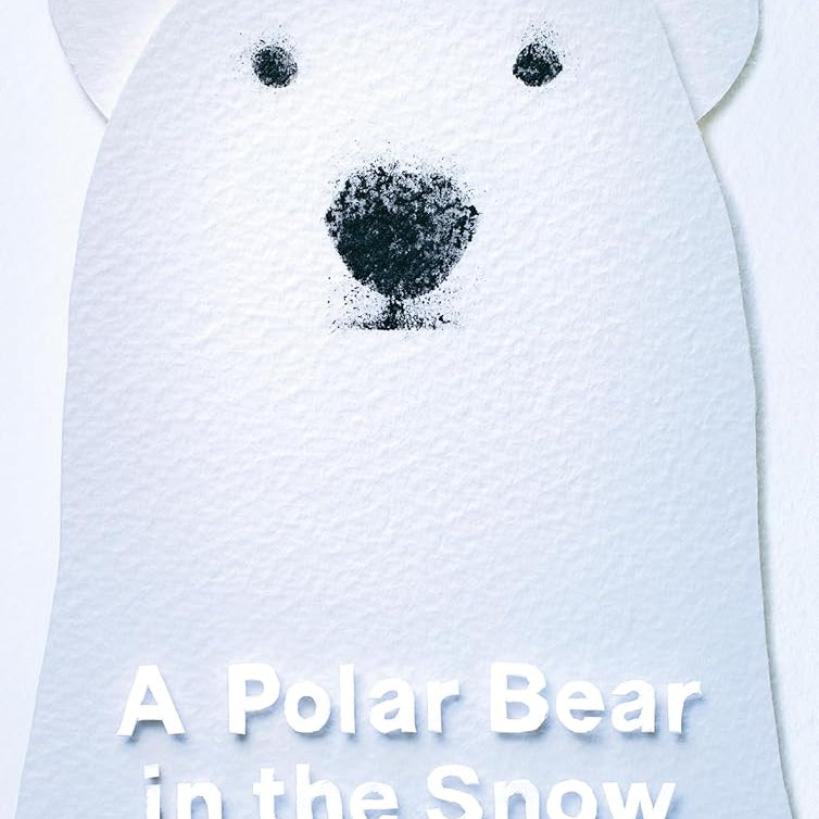 A Polar Bear in the Snow cover image